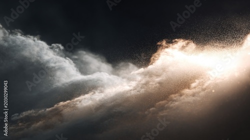 Dramatic luminous light penetrates through dense atmospheric cloud formations against a dark sky