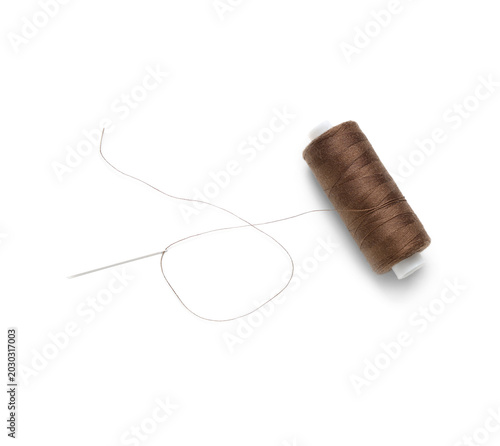Brown sewing thread spool a...