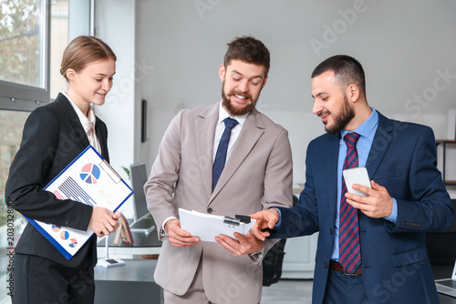 Happy business partners wit...