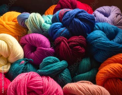 A vibrant collection of colorful yarns neatly arranged