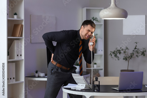 Young businessman with tele...