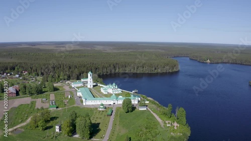 Drone footage of Alexander-Svirsky Monastery and Roshchinskoe lake on sunny summer day. Leningrad Oblast, Russia.