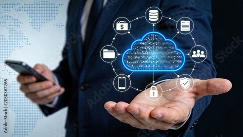 Businessman hand holding glowing cloud computing network with connected icons for database, finance, documents, users, mobile, security and folders, representing integrated