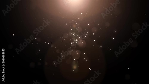 Abstract gold particles floating with elegant bokeh lights and warm lens flare on a black background, seamless loop motion graphic.