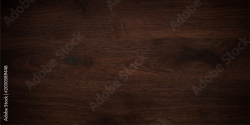 Obraz na płótnie A close-up, high-angle view of a dark, rich wooden surface with visible grain and texture