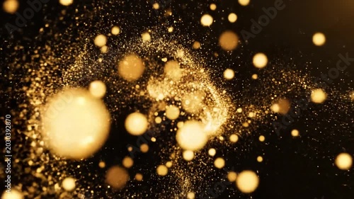 Abstract golden dust particles with bokeh effect on black background