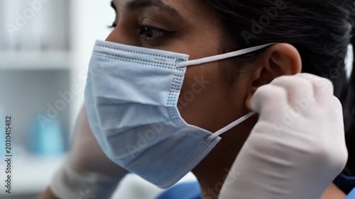Person Wearing Mask in Close Up Medical Setting
