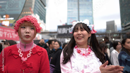 Bild auf Leinwand Two Young Women in Colorful Harajuku Decora Fashion at Shibuya Crossing