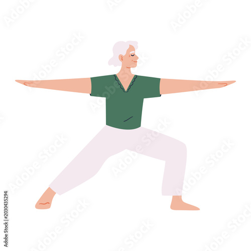 Quadro su tela Senior woman practicing warrior yoga pose