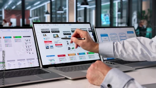 Man Focused On Computer Screen Developing User-friendly App
