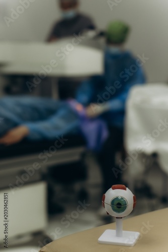 Eye model in blurred ophthalmology clinic setting