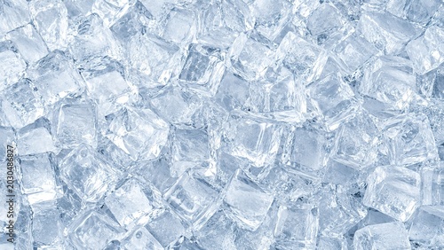 background of transparent ice cubes with frozen texture. Refreshing cold concept, winter freshness, beverage cooling, frozen water, Top view.