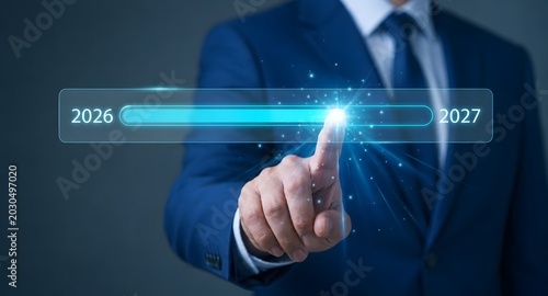 Businessman touching glowing timeline progress bar moving from 2026 to 2027