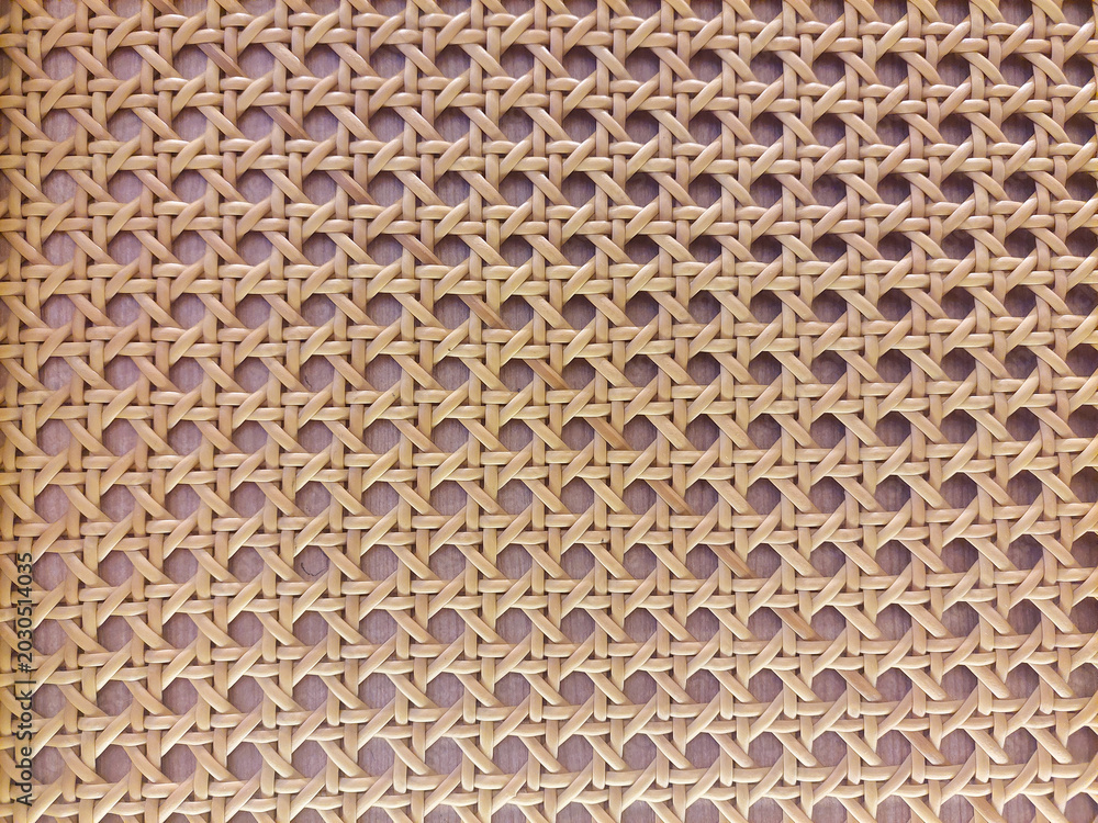 Fototapeta premium Woven rattan texture background with geometric pattern