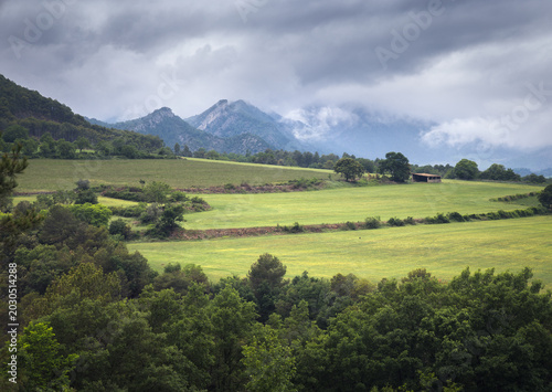 Discovering Vall De Cabo's Green Valleys in Catalonia on a Cloudy Day