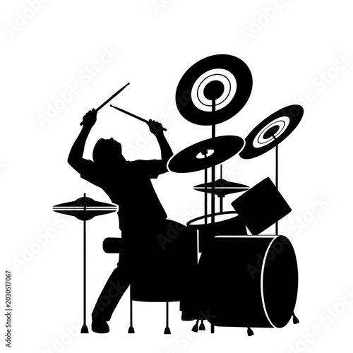 Photos Silhouette of a drummer playing a drum set with energy