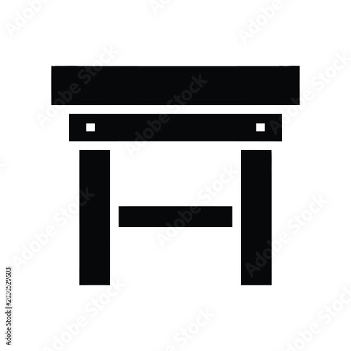 Fotografie Black silhouette of a wooden stool with four legs and a crossbar, representing f