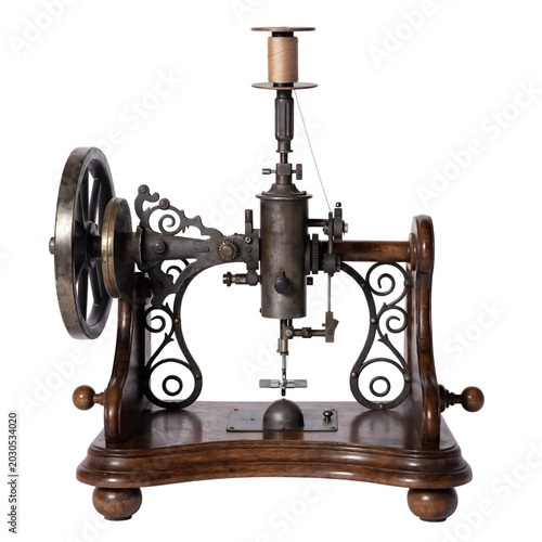 Vintage antique metal sewing machine on wood base