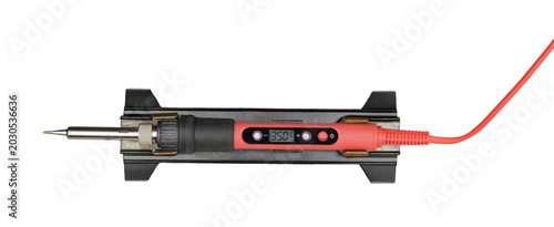 Red electric soldering iron on a stand