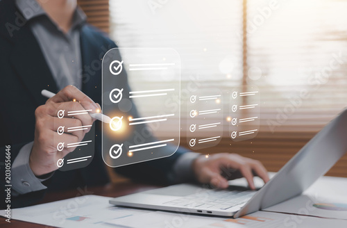 Fotografija Business checklist and task management concept with digital to do list interface on laptop