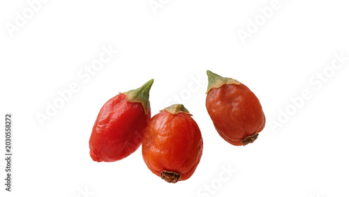 Cuadro en lienzo Three small red goji berries with green stems, isolated on transparent backgroun