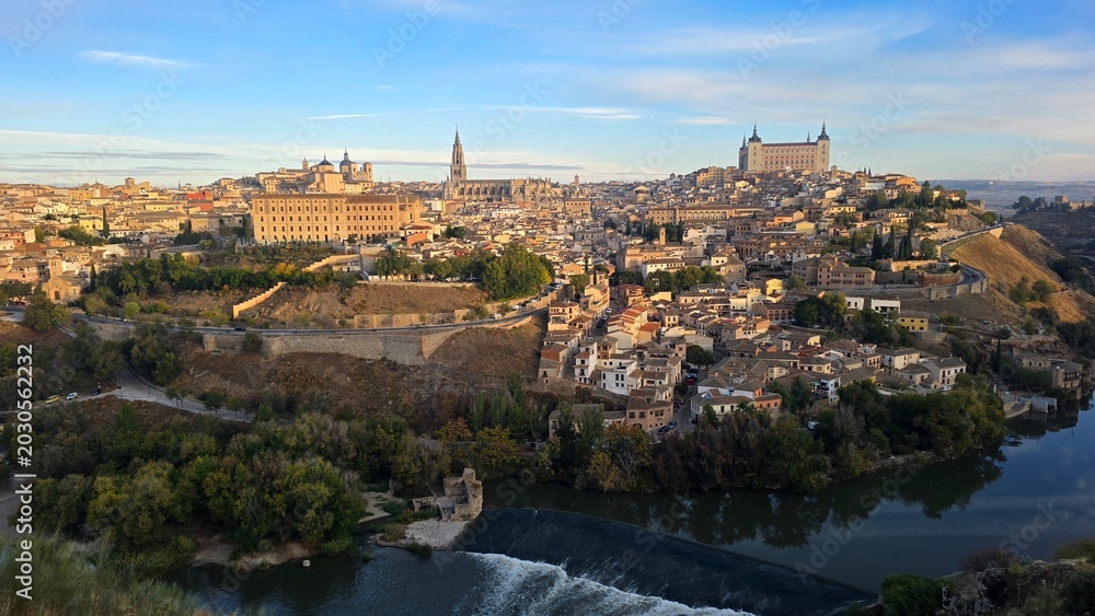 Fototapeta premium Panoramic view of historic Toledo skyline and Tagus river at sunrise.