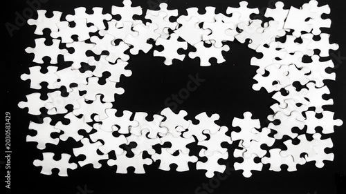 Jigsaw transition on black stop motion 