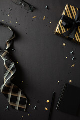 Elegant masculine birthday or anniversary concept with gift and tie. Happy Fathers Day vertical banner design