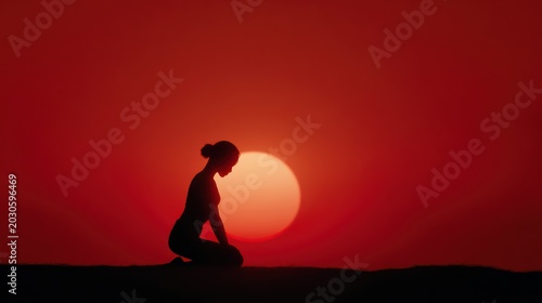yoga pose silhouette of woman on open land with red sunset sun behind her, clean minimal horizon and dramatic lighting