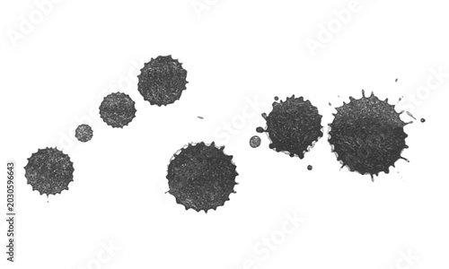 Set of Textured Black Paint Drops and Circular Splatters on White Surface