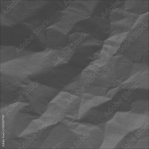Foto A close-up grayscale photograph shows crumpled paper texture with deep folds and shadows
