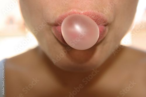Woman doing chewing gum bubble