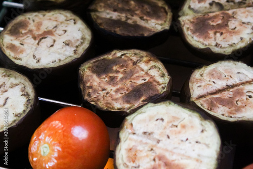 Photos grilling eggplant slices on the grill