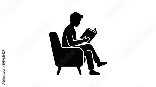 Foto Reader sits comfortably in an armchair while engrossed in a physical book during a quiet afternoon of leisure
