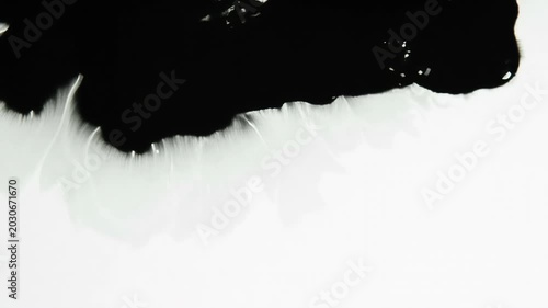 Influx of Black Ink. Streaks of black paint gradually closed white screen. Excellent for inter-frame transition
