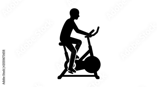 Photography Cyclist silhouette exercises on a stationary exercise bike to maintain physical fitness and improve cardiovascular endurance