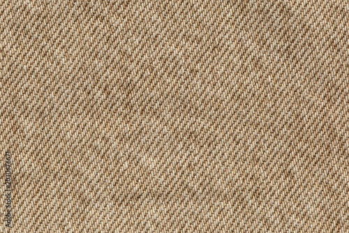 macro of beige jeans denim fabric texture