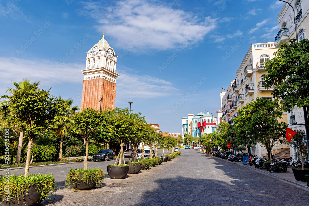 Fototapeta premium Phu Quoc, Vietnam - January 3 2026: Mediterranean clock tower square in Sunset Town Phu Quoc