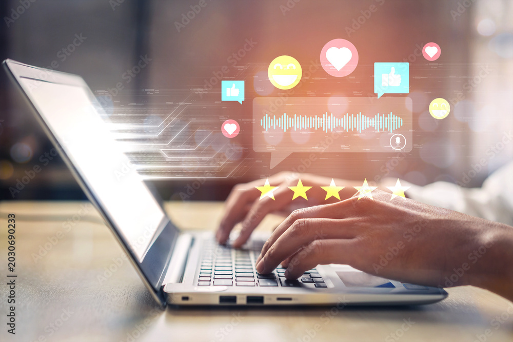 Obraz premium Person Using Laptop with Digital Communication Icons, Social Media Feedback and Engagement Symbols Concept for Online Interaction and Response Ledger.