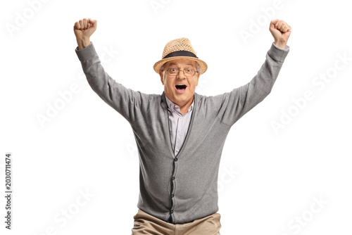 Tableau sur toile Overjoyed elderly man gesturing happiness
