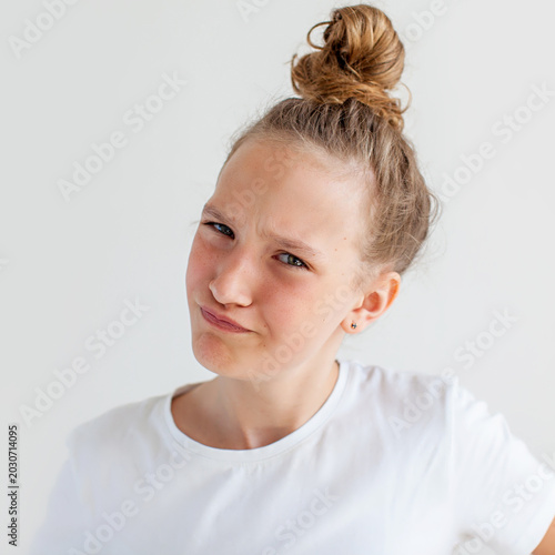 Cuadro en lienzo Teenager girl with skeptical facial expression looking at camera