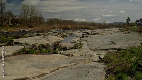 Agueda river flowing low through an exposed rocky riverbed near Puente del Co...