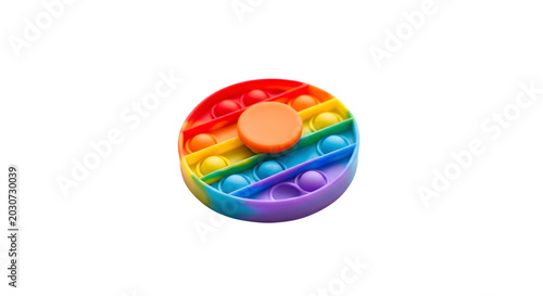 A rainbow-colored fidget spinner toy sits on a clean surface.