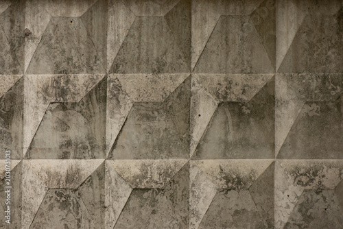 Gray background with geometric concrete wall texture. Modern architectural surface with grunge details, ideal for backgrounds, wallpapers, construction themes, branding.