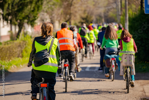Group of cyclists on city road, street, asphalt