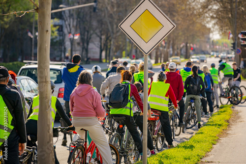 Group of cyclists on city road, street, asphalt