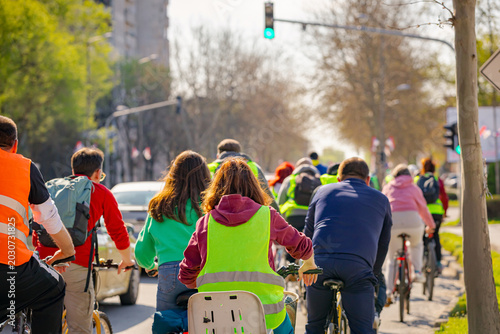 Group of cyclists on city road, street, asphalt