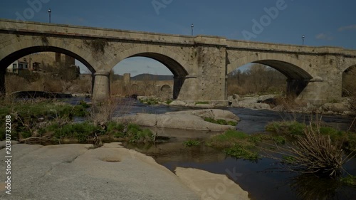 Historic stone arch bridge over the Tormes river in Puente del Congosto
