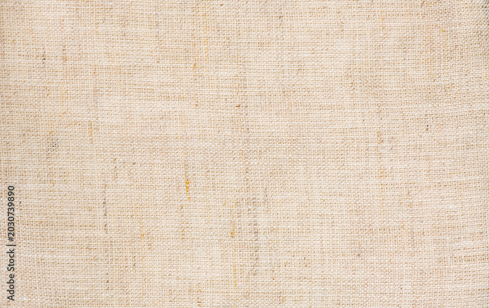 Fototapeta premium Natural linen fabric texture background, linen canvas backdrop, natural eco linen background. Bio textile material backdrop, canvas top view, close up 