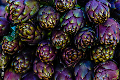 Photos Fresh purple artichokes close up